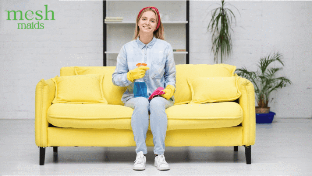 Female professional cleaner holding cleaning supplies