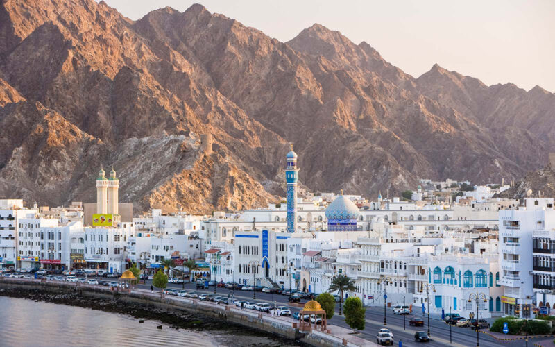 Middle East, Oman, Muscat, Mutrah, elevated view along the Corniche, latticed houses and Mutrah Mosque